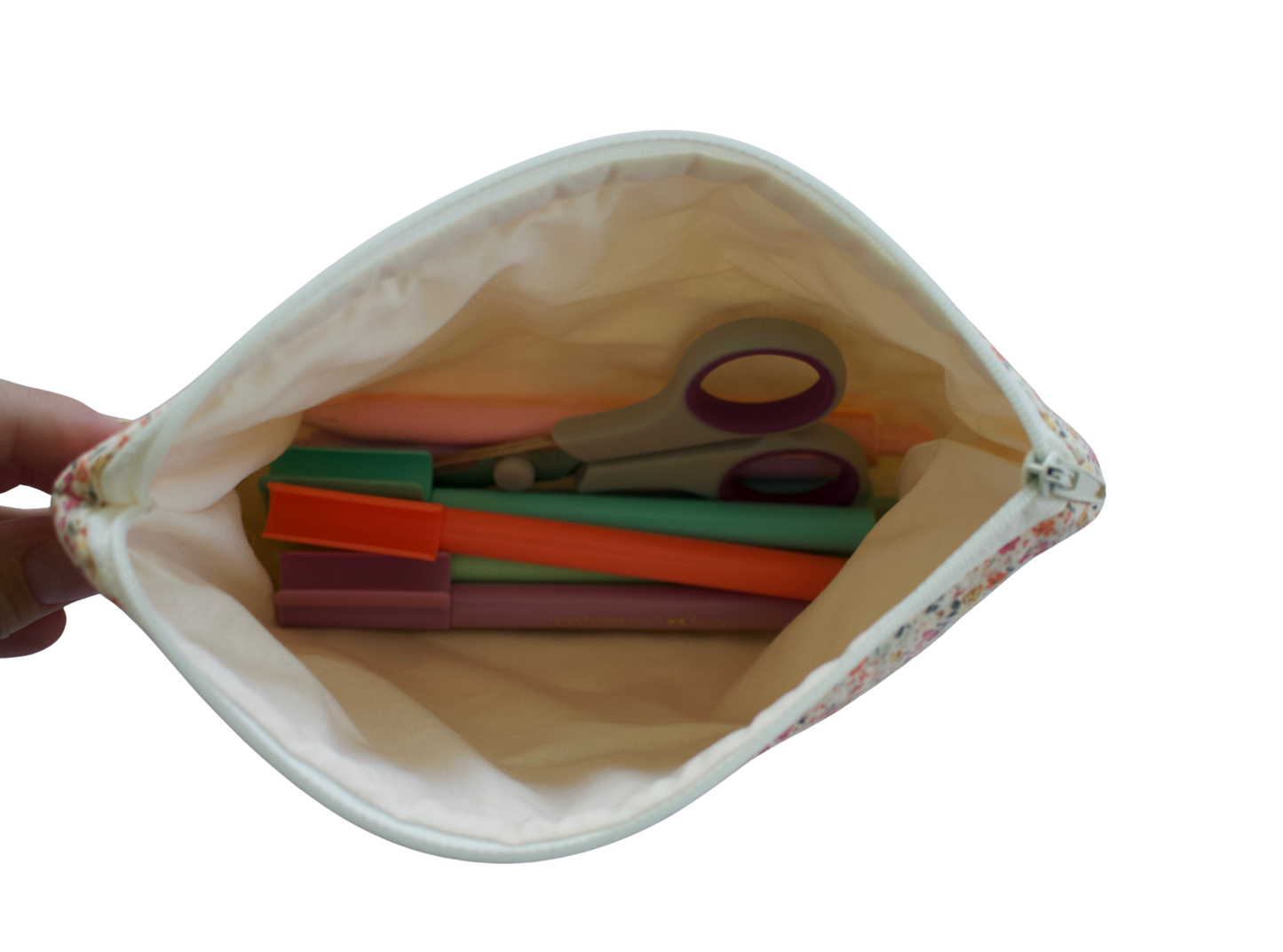 Pouch with colorful items including scissors and straws on a white background zipper pouch