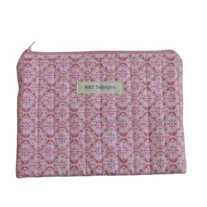 Pink patterned pouch with a brand label zipper pouch
