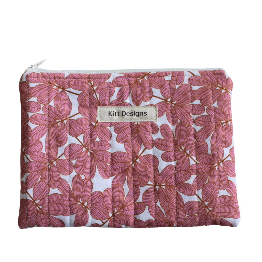 Floral-patterned pouch with a visible brand label zipper pouch