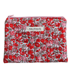 Floral patterned pouch with 'Kitt Designs' label zipper pouch