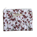 Floral-patterned pouch with 'Kitt Designs' branding zipper pouch