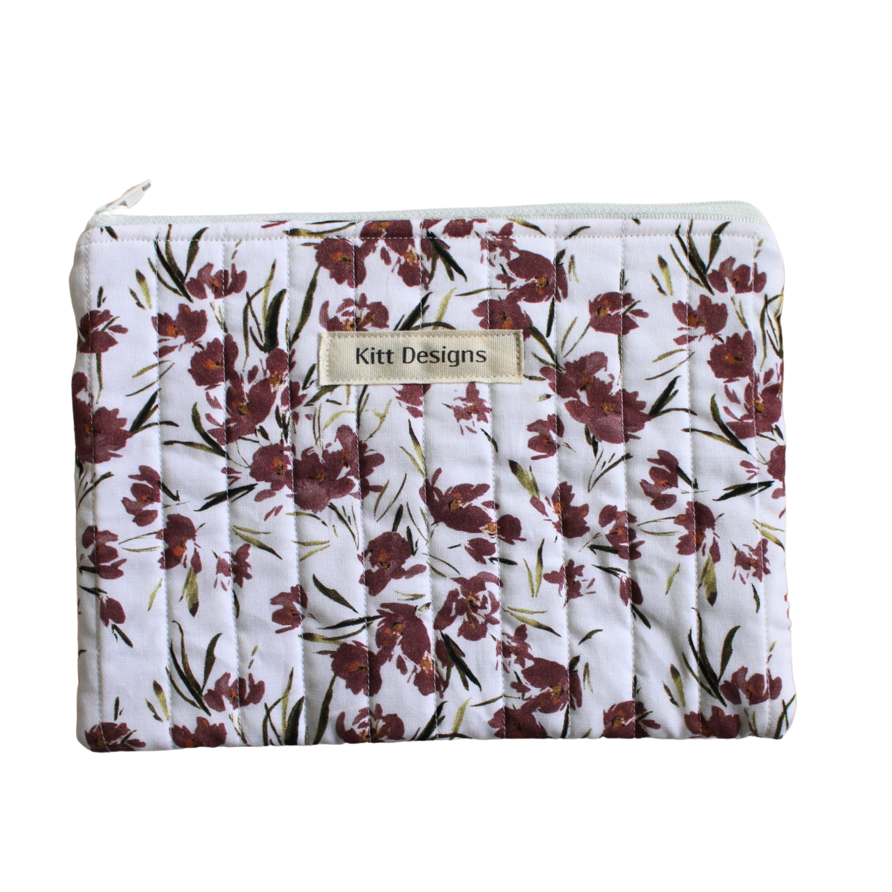 Floral-patterned pouch with 'Kitt Designs' branding zipper pouch