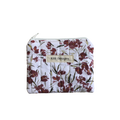 Floral-patterned pouch with 'Kitt Designs' label coin pouch
