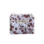 Floral-patterned pouch with 'Kitt Designs' label coin pouch