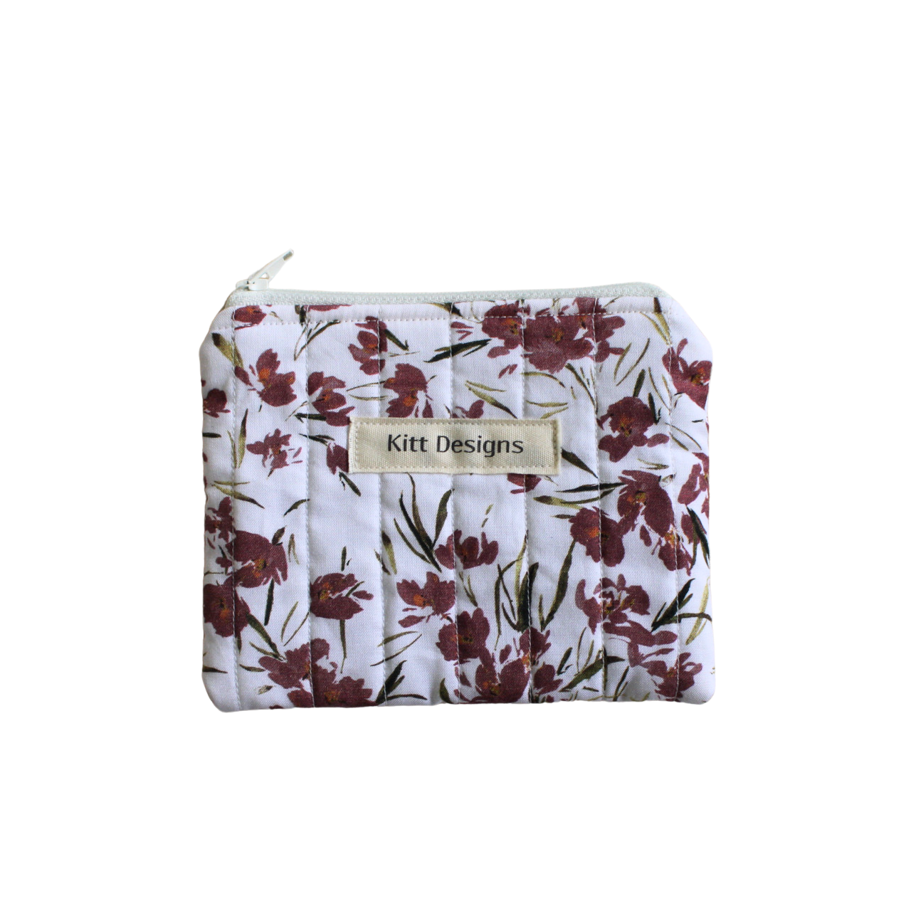 Floral-patterned pouch with 'Kitt Designs' label coin pouch