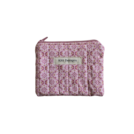 Small pink patterned pouch with a brand label coin pouch