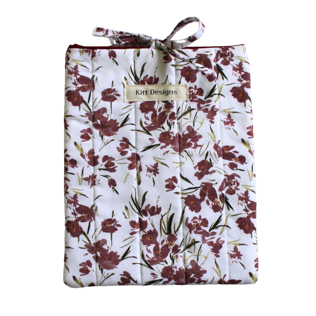 Floral-patterned product with a visible brand label small book sleeve