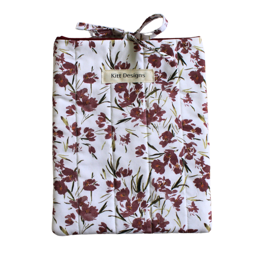Floral-patterned product with a visible brand label small book sleeve