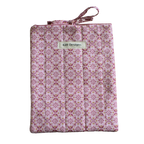 Patterned fabric package with 'Kitt Designs' branding small book sleeve