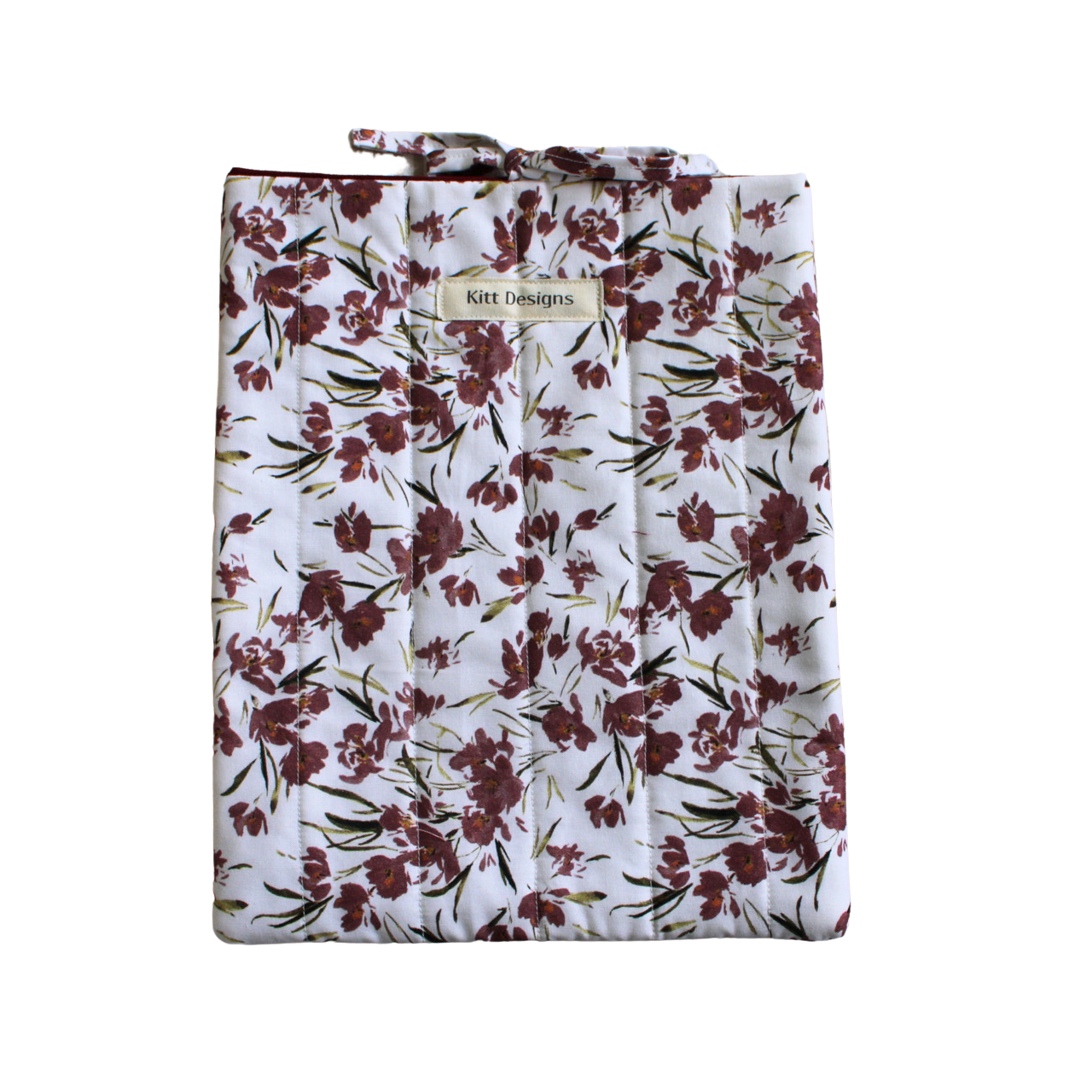 Floral-patterned bag with a visible brand label large book sleeve