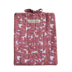 Pink floral-patterned quilt with a brand label large book sleeve