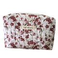 Floral-patterned pouch with 'Kitt Designs' label beauty pouch