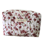 Floral-patterned pouch with 'Kitt Designs' label beauty pouch