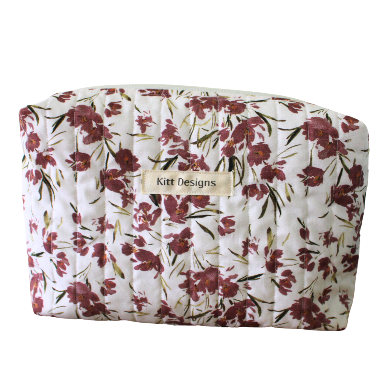 Floral-patterned pouch with 'Kitt Designs' label beauty pouch