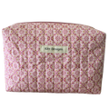 Patterned pouch with 'Kitt Designs' label beauty pouch