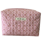 Patterned pouch with 'Kitt Designs' label beauty pouch