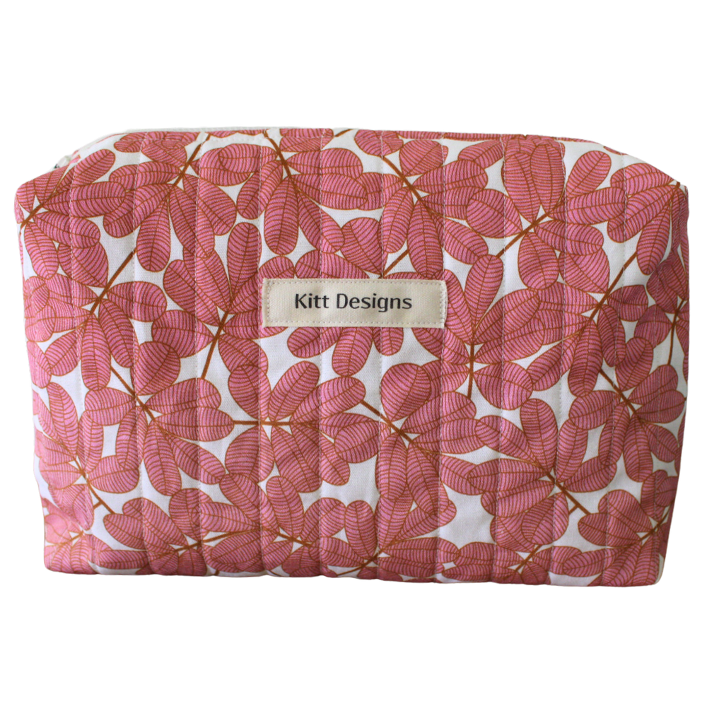 Floral patterned pouch with 'Kitt Designs' label beauty pouch