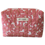 Floral patterned pouch with 'Kitt Designs' label beauty pouch