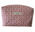 Patterned pouch with 'Kitt Designs' label travel pouch