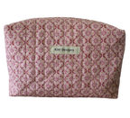 Patterned pouch with 'Kitt Designs' label travel pouch