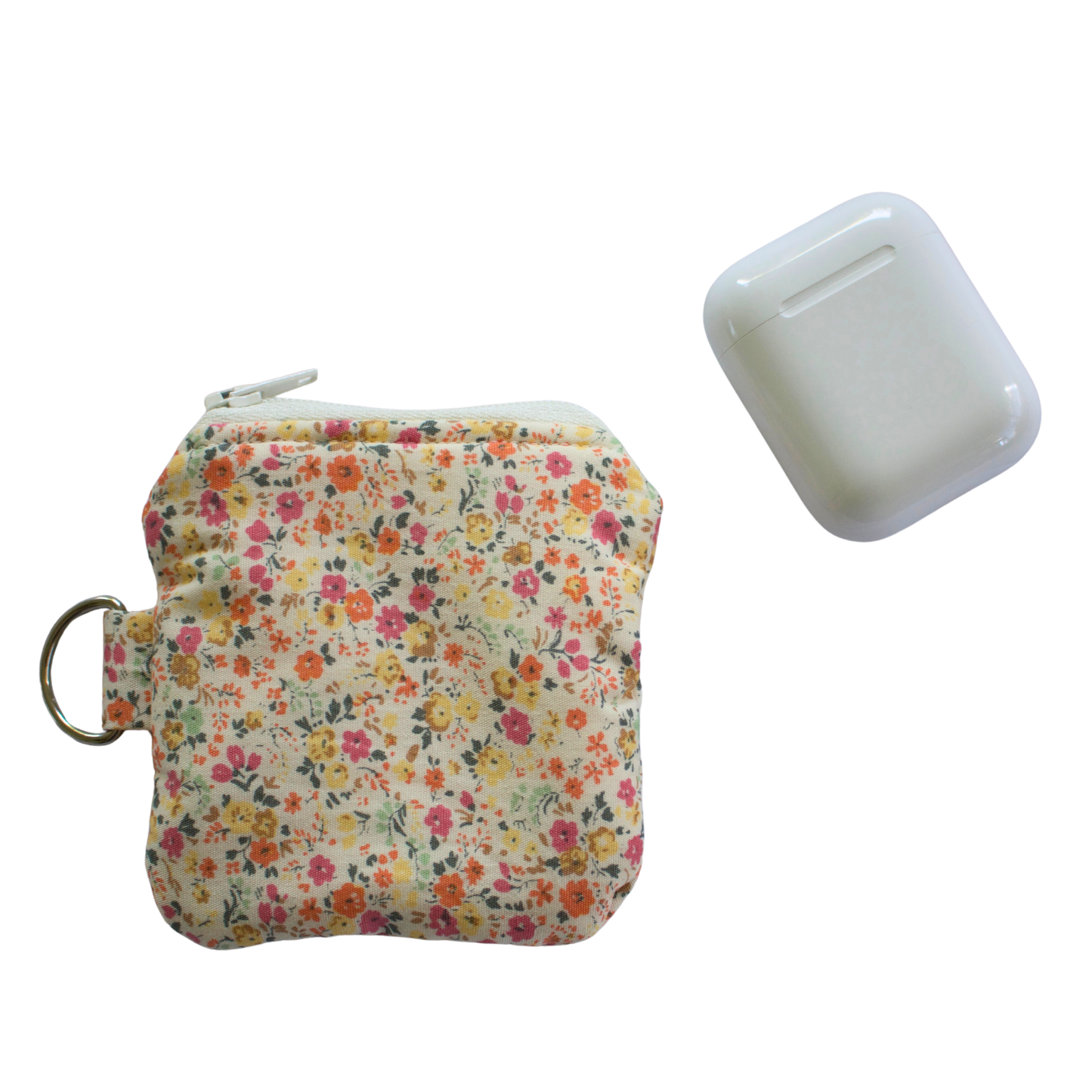 Floral-patterned AirPod pouch with AirPods