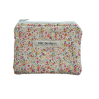 Floral patterned pouch with 'Kitt Designs' label coin pouch coin purse