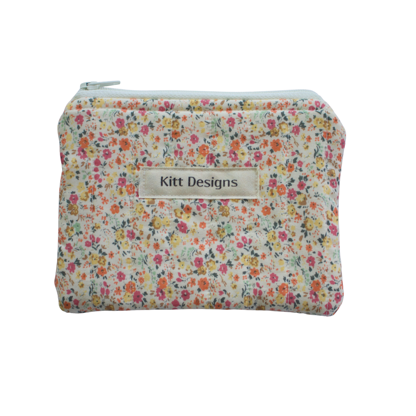 Floral patterned pouch with 'Kitt Designs' label coin pouch coin purse