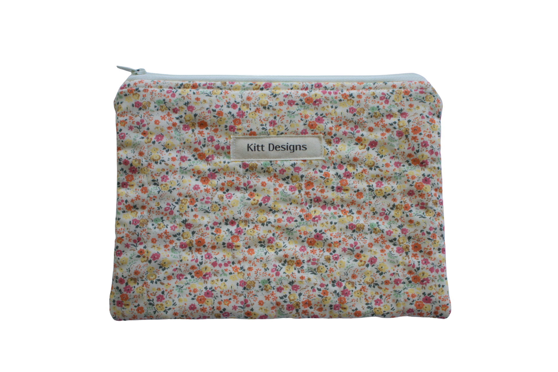 Floral patterned pouch with 'Kitt Designs' label zipper pouch
