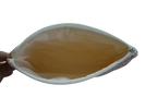 Hand holding a leaf-shaped pouch with a yellowish-brown interior on a white background zipper pouch