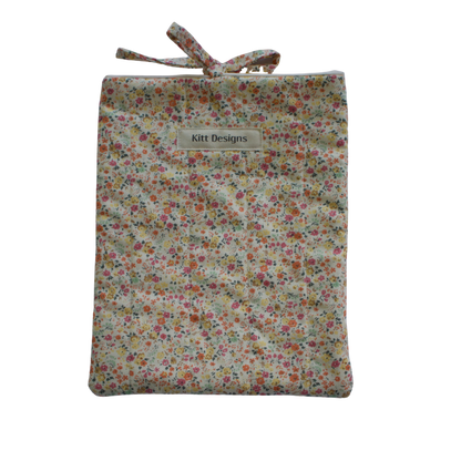 Floral patterned drawstring bag on a white background small book sleeve