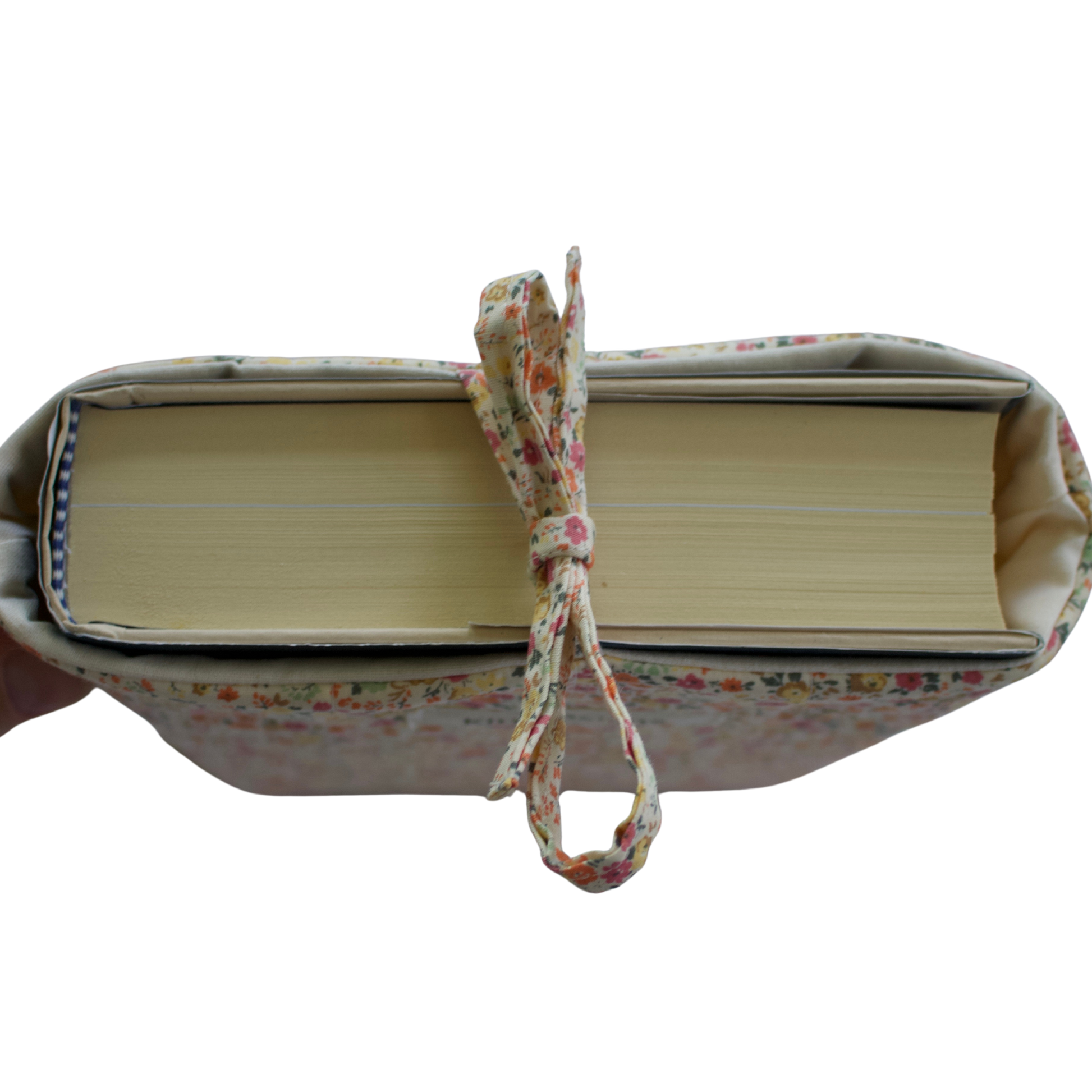 fabric book with a floral ribbon on a white background book sleeve