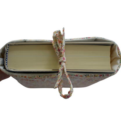 fabric book with a floral ribbon on a white background book sleeve