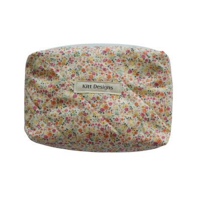 Floral-patterned pouch with 'Kitt Designs' mini pouch