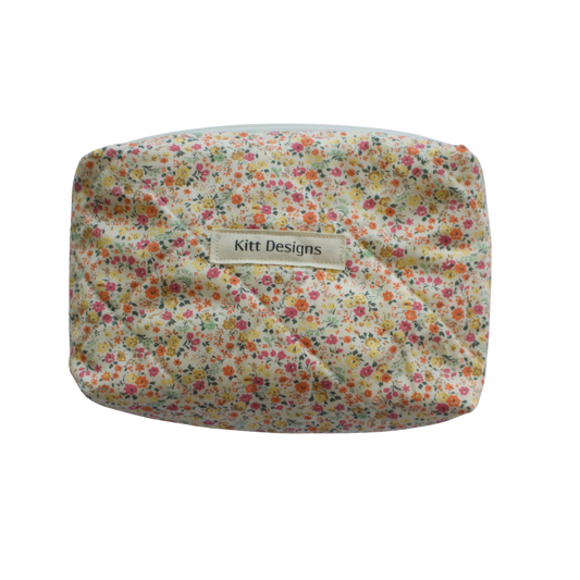 Floral-patterned pouch with 'Kitt Designs' mini pouch