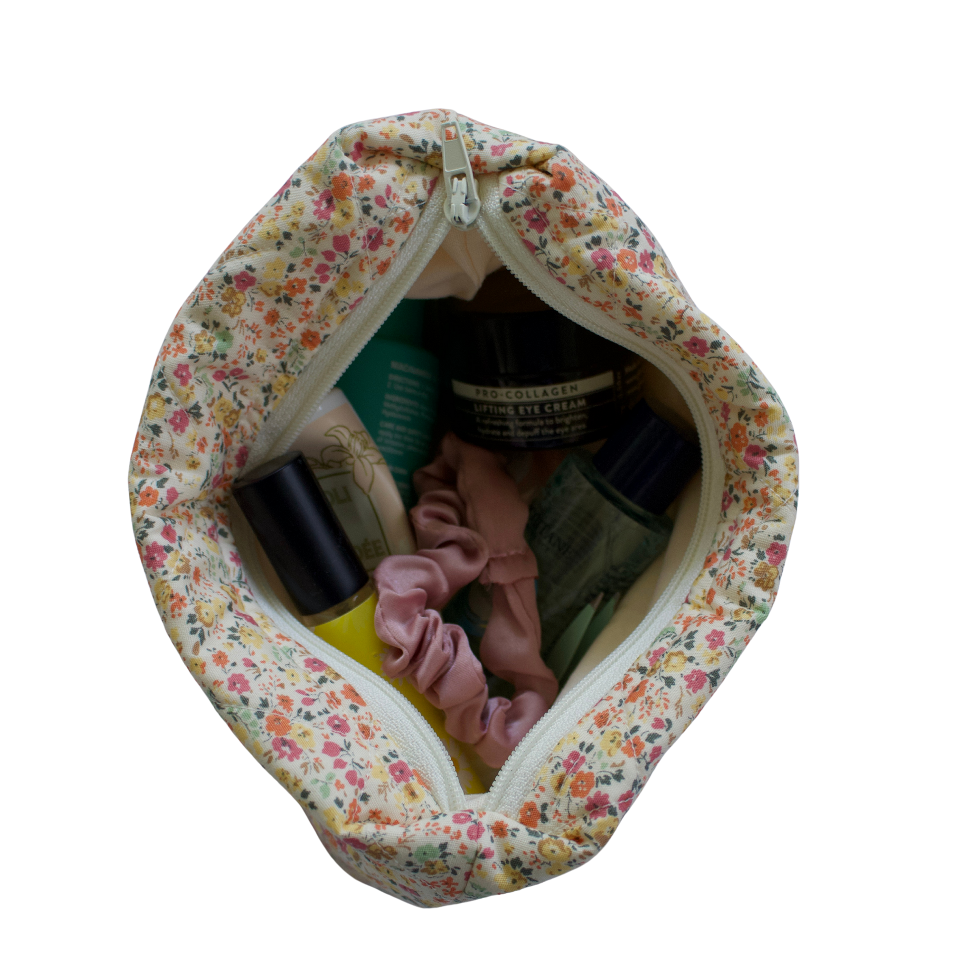 Floral-patterned baby care bag with items inside on a white background mini pouch