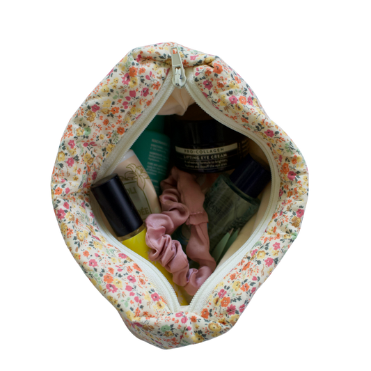 Floral-patterned makeup bag with cosmetic items mini pouch