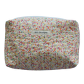 Floral-patterned pouch with 'Kitt Designs' beauty pouch