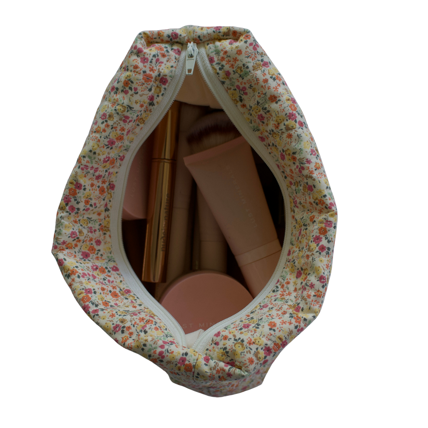 Floral-patterned fabric cover with a zipper for cardboard boxes on a white background