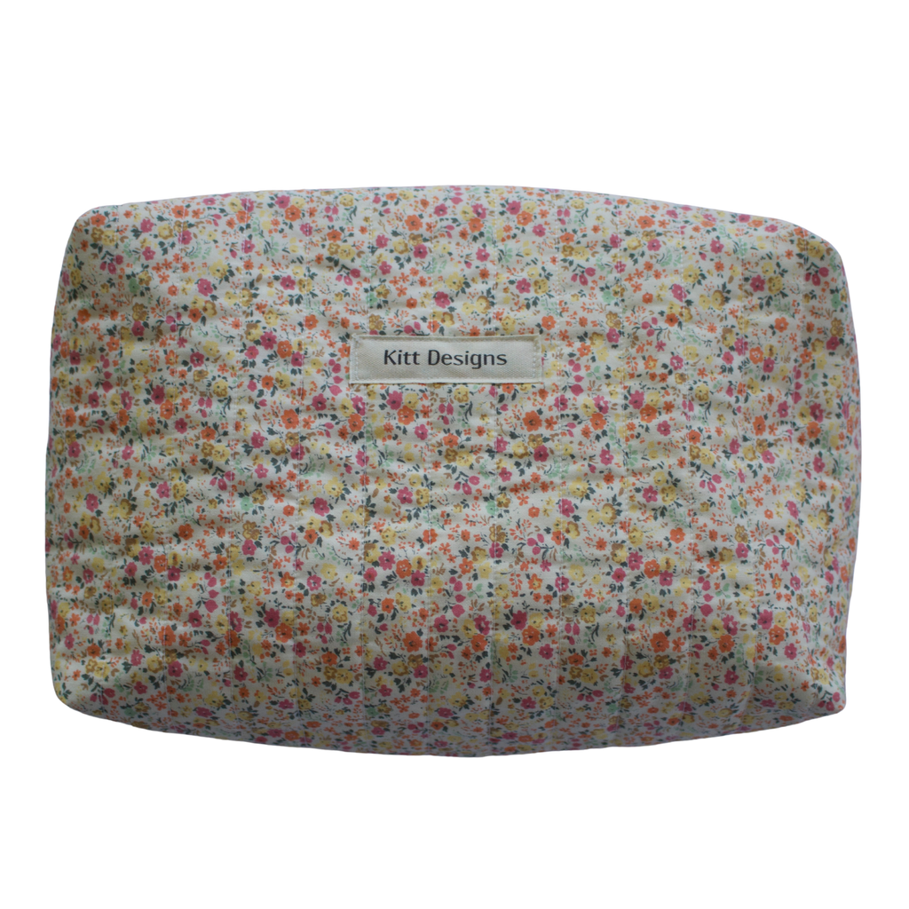 Floral patterned product with 'Kitt Designs' branding beauty pouch makeup bag