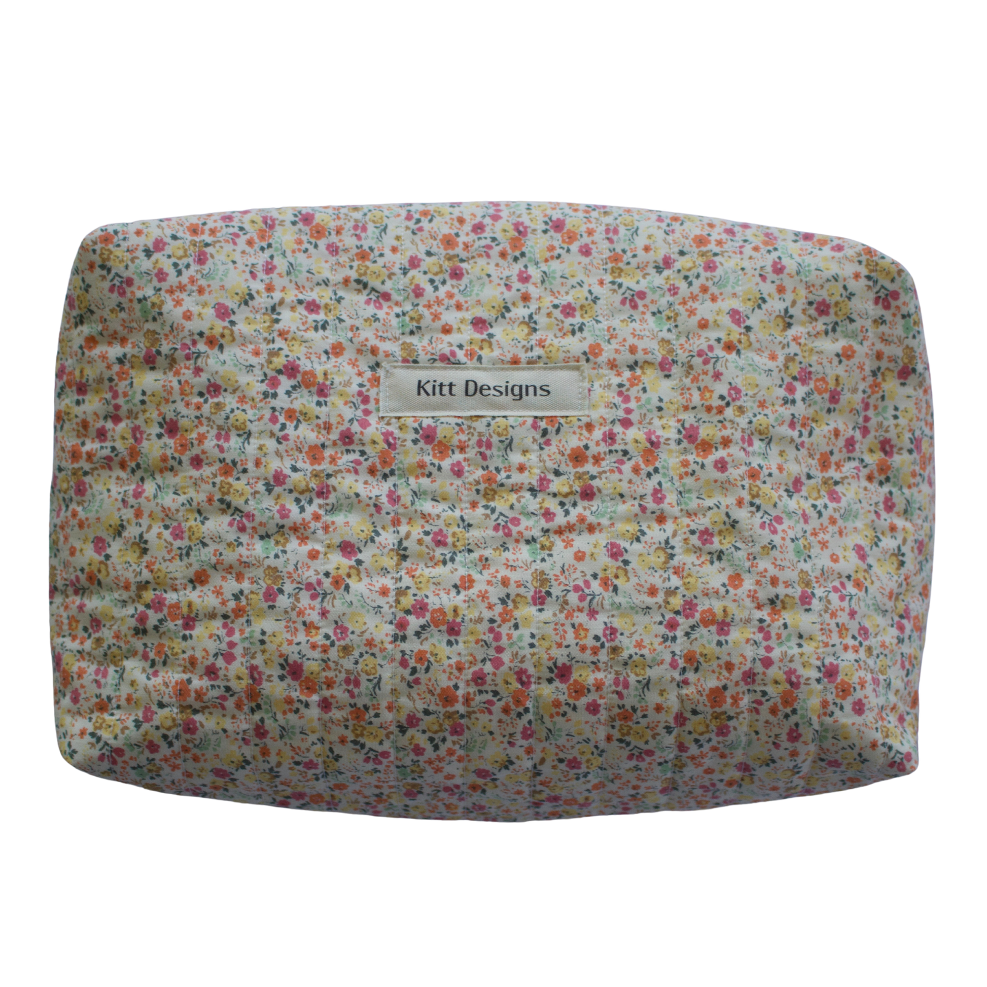 Floral patterned product with 'Kitt Designs' branding beauty pouch makeup bag