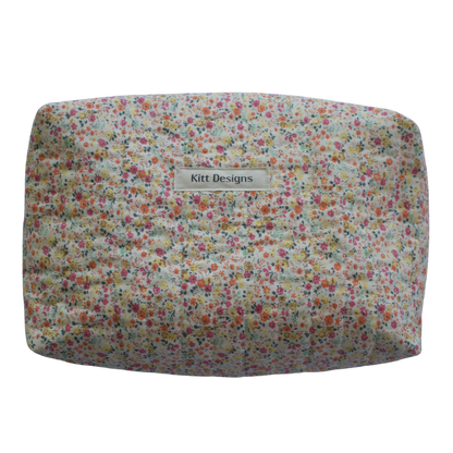Floral patterned product with 'Kitt Designs' branding beauty pouch makeup bag