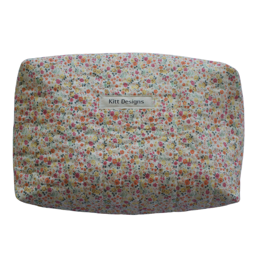 Floral patterned product with 'Kitt Designs' branding beauty pouch makeup bag