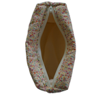 Floral-patterned fabric bag with a zipper on a white background travel pouch