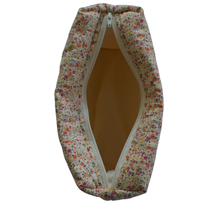 Floral-patterned fabric bag with a zipper on a white background travel pouch