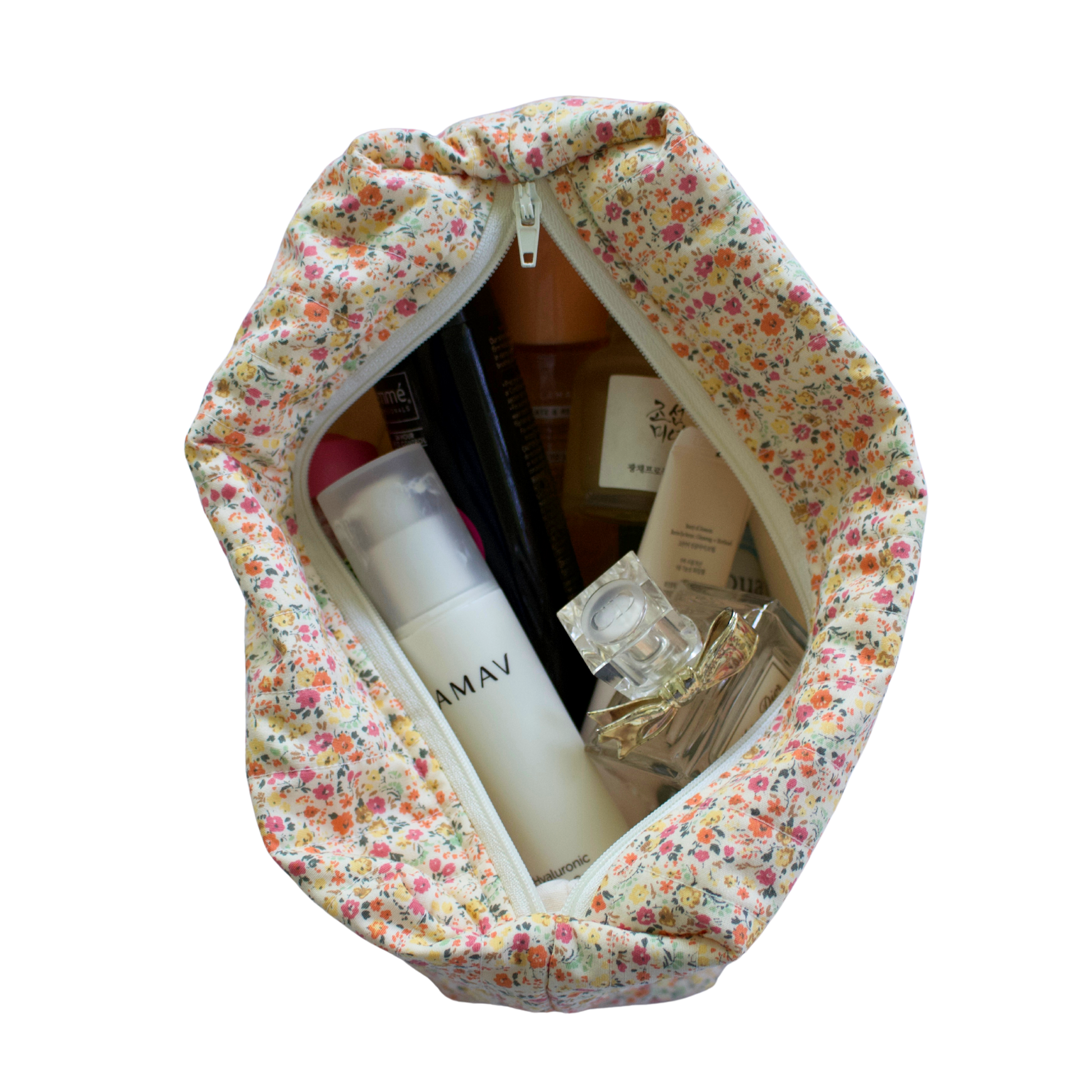 Floral-patterned makeup bag with skincare products on a white background beauty pouch