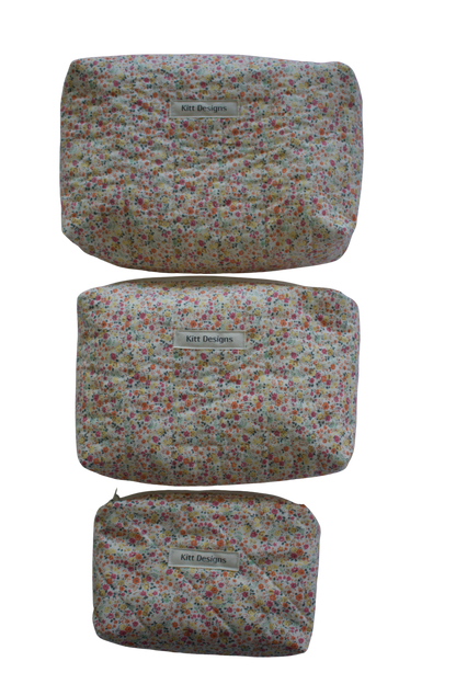 Set of three floral-patterned pouches with a visible brand label on a white background travel pouch beauty pouch mini pouch