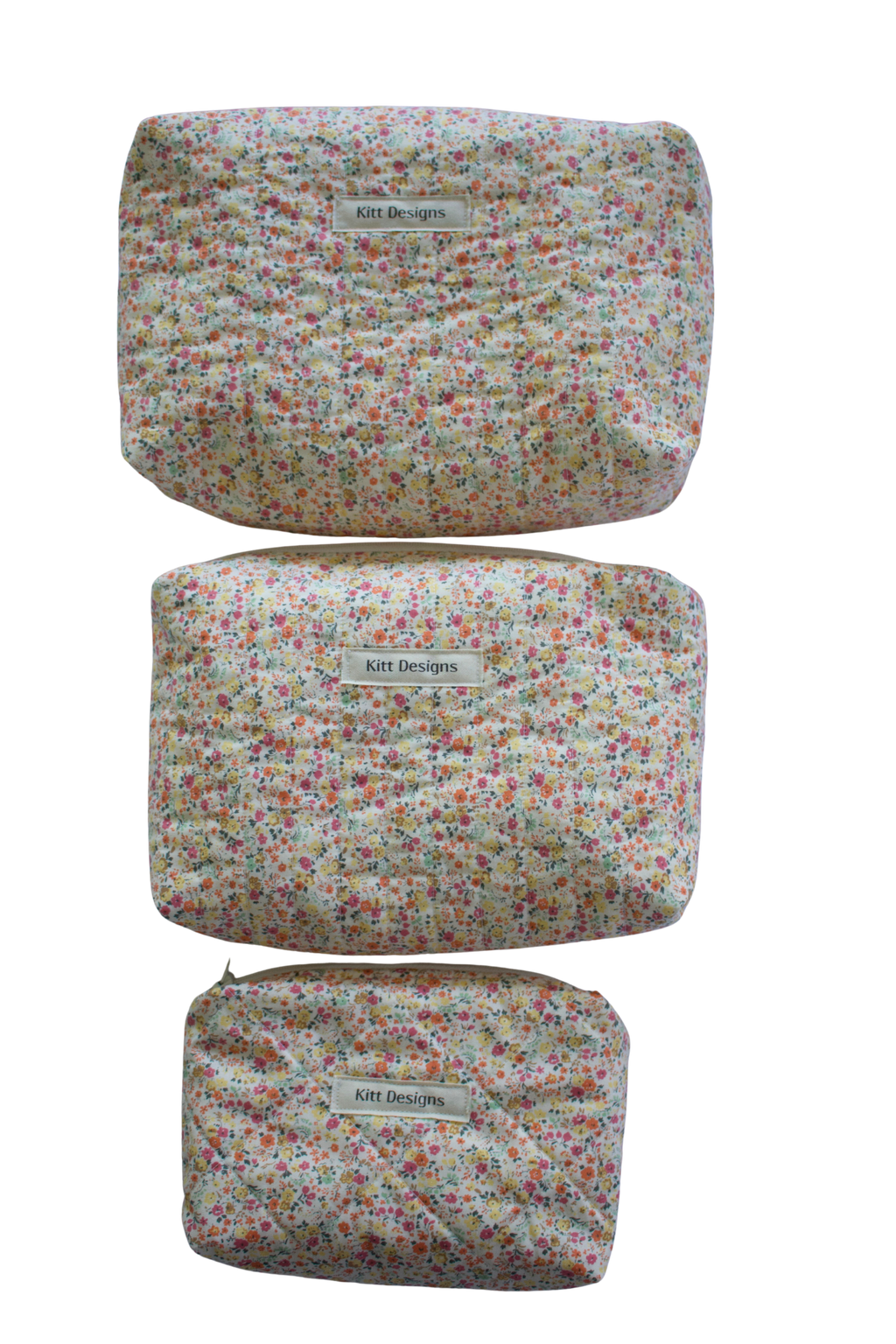 Three floral-patterned pouches with 'Kitt Designs' label beauty pouch travel pouch mini pouch