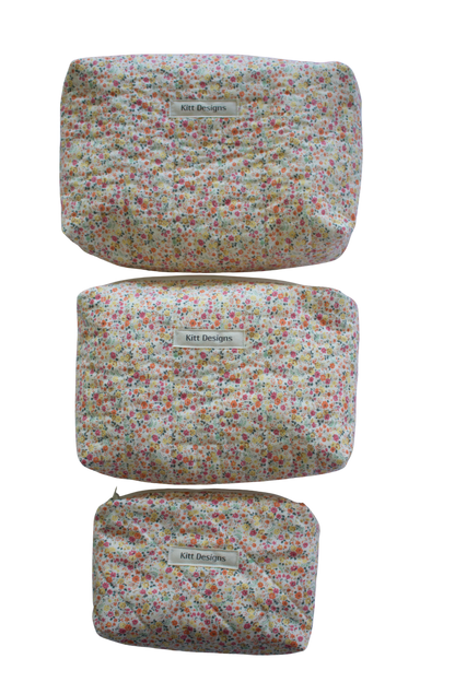 Three floral-patterned pouches with 'Kitt Designs' label beauty pouch travel pouch mini pouch