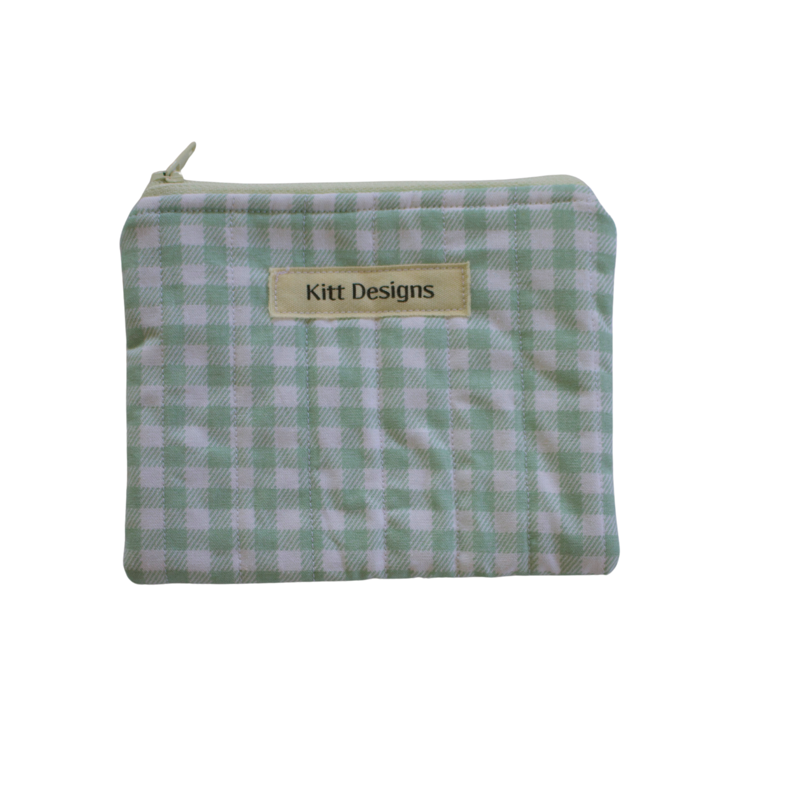 Green checkered pouch with a visible brand label green gingham coin pouch