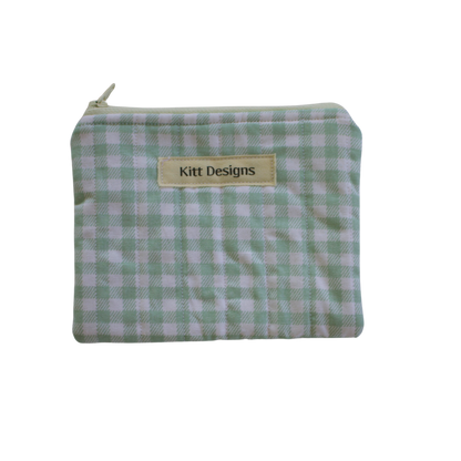 Green checkered pouch with a visible brand label green gingham coin pouch